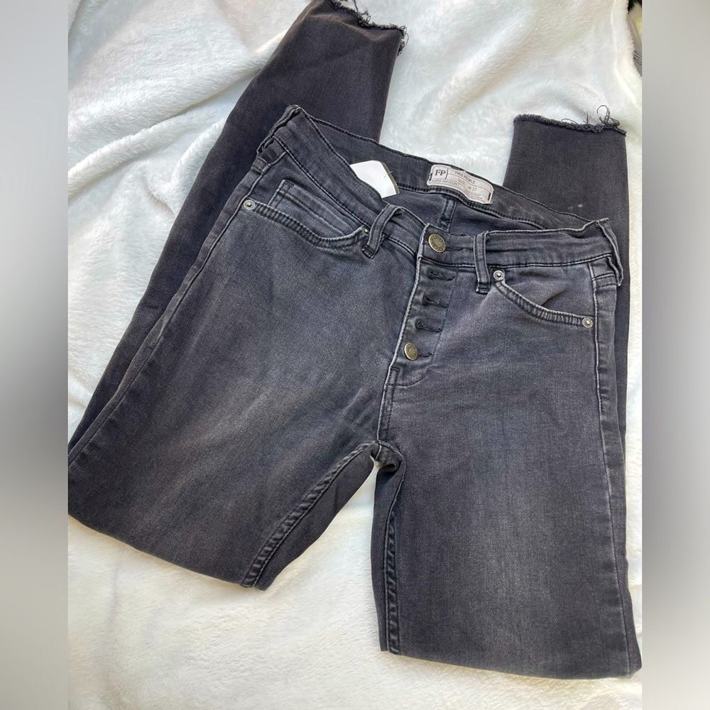 We the Free People black distressed denim jeans. Size W27